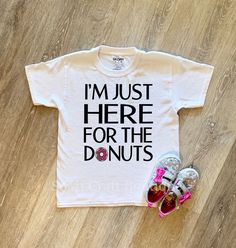 i'm just here for the donuts t - shirt and pair of baby shoes