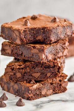 three chocolate brownies stacked on top of each other