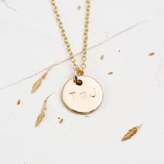 Initial 9ct Gold Disc I love You Necklace This delicate and subtle gold necklace is personalised with your choice of initials around a little love heart. A wonderful gift for a wife or girlfriend, this custom necklace is perfect for anniversaries or at Christmas. Each initial is delicately engraved with initials and individually hand engraved to order, allowing you to create a unique and personal gift. This necklace is a lifelong gift, designed to be worn daily, as well as for special occasions. Dainty Initials Necklace For Anniversary, Valentine's Day Yellow Gold Initial Name Necklace, Minimalist Hand Stamped Initial Necklace For Anniversary, Minimalist Initial Pendant Name Necklace For Anniversary, Minimalist Initial Necklace With Heart Charm For Anniversary, Minimalist Initial Pendant Charm Necklace For Anniversary, Minimalist Initial Pendant Charm Necklace For Anniversary Gift, Delicate Initials Name Necklace For Anniversary, Rose Gold Initial Necklace For Anniversary