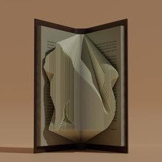 an open book with folded pages in it