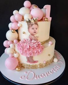 a birthday cake decorated with balloons and a photo on the top is for a princess