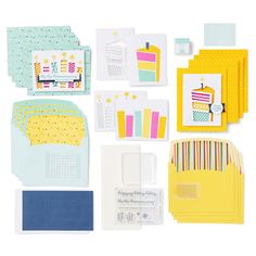 various cards and envelopes are arranged on a white surface