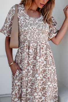 This darling maxi dress is perfect for any fall event! This Cream Print Smocked Maxi Dress features a flattering smocked waist and short puff sleeves for a feminine touch. The scoop neckline and back self-tie closure add elegant detail, while the allover print adds a pop of color. With the added convenience of side pockets and partial lining, this dress combines style and functionality. Style with strappy heels and a matching crossbody bag for an elevated boho chic look! Sorority Rush Outfits, Rush Outfits, Smocked Maxi Dress, Gameday Dress, Loungewear Dresses, Casual White Dress, Game Dresses, Strappy Heels, Black Maxi Dress