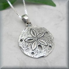 "A beautifully detailed sand dollar pendant is simple and stunning in this beach necklace. This is the perfect necklace for summer! Sterling silver box chain. Pendant is 5/8\" round (1.59 cm). All components are sterling silver. Coordinating earrings for this piece can be found here: https://www.etsy.com/listing/191376144/sanddollar-earrings-sterling-silver-sand?ref=shop_home_active_4 Jewelry is packaged in a cotton lined box for gift-giving. See more Bonny Jewelry at http://bonnyjewelry.etsy.co Sterling Silver Pendant Jewelry For Beach, Engraved Pendant Necklace For Beach, Beach Pendant Jewelry With Engraving, Beach Engraved Pendant Jewelry, Adjustable Engraved Necklaces For Beach, Adjustable Engraved Necklaces For The Beach, Silver Starfish Charm Necklace For Summer, Silver Starfish Jewelry For Beach, Silver Starfish Jewelry For Vacation