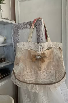 an old purse is sitting on top of a chair in front of a door with lace