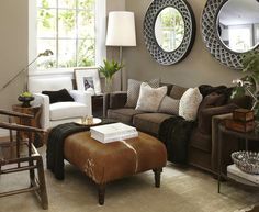 a living room filled with furniture and mirrors