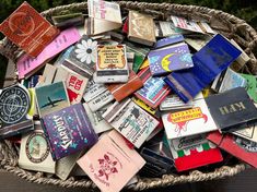 a basket filled with lots of different colored books