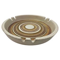 a white bowl with an abstract design in the center