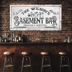 three stools in front of a bar with a sign on the wall above it