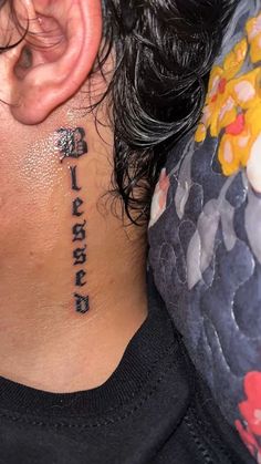 a woman with a tattoo on her neck