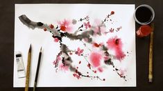 the paint is being used to create an abstract painting on paper with watercolors