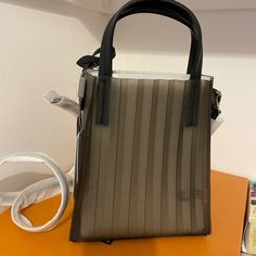 It’s A Small, Special Plastic Bag, Very Popular, Made In Korea. Casual Satchel With Removable Pouch For Evening, Casual Evening Satchel Bucket Bag, Casual Evening Bucket Bag With Detachable Handle, Casual Evening Crossbody Bucket Bag, Casual Evening Bag With Adjustable Strap, Casual Bucket Bag For Evening, Casual Evening Bucket Bag, Casual Evening Bag With Detachable Handle, Evening Tote Satchel With Mobile Phone Bag