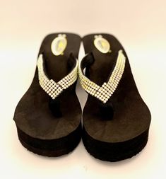 Take a step in chic style with the Balero Wedge AB Crystal Flip Flops! These 3" inch heels are perfect for a day on the town or a night out with friends. Step up your look with a little sparkle and shine! Summer Heels With Bling And Round Toe, Summer Bling Heels With Round Toe, Black Wedge Sandals With Rhinestones And Round Toe, Glamorous Platform Wedge Sandals For Beach, Black Rhinestone Wedge Sandals For Beach, Glamorous Round Toe Wedge Sandals For Beach, Glamorous Synthetic Wedge Sandals For Beach, Night Out With Friends, 3 Inch Heels