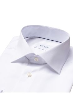 Modern French cuffs add elegance to a spread-collar dress shirt richly woven from pure cotton. Since 1928, Eton has been making men’s shirts that meet the highest expectations of quality, fusing Scandinavian sensibilities and the rich traditions of English textiles. They make a shirt that is well worth wearing, and because they take ownership of the production process from day one, the quality never wavers. Permanent collar stays. French placket. Curved hem. Back yoke. 100% cotton. Machine wash Luxury Cotton Dress Shirt For Office, Luxury Cotton Business Shirt, Luxury Cotton Dress Shirt For Semi-formal Occasions, Luxury Dress Shirt With Concealed Placket For Office, Luxury Business Casual Shirt, Luxury Semi-formal Collared Dress Shirt, Luxury Dress Shirt With Button Cuffs And Spread Collar, Luxury Dress Shirt With Spread Collar And Button Cuffs, Luxury Dress Shirt With Spread Collar For Work