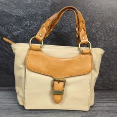 Gently used, clean vintage Eddie Bauer canvas and leather small handbag purse. Zippers work. One zipper pocket and two pouches inside. Brass accents. Perfect accessory to a Classic, Heritage, or Light Academia look. Approximately 10.5" wide, 8" tall Handbag Vintage, Eddie Bauer Women, Heritage Fashion, Small Handbag, Top Handle Bags, Canvas Handbags, Brass Accents, Light Academia, Small Handbags