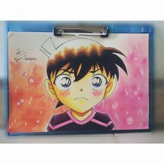 a clipboard with an anime character drawn on it