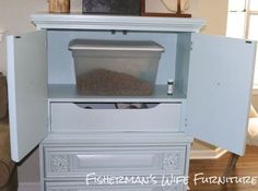 an old fashioned cabinet has been turned into a litter bin