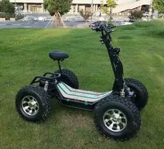 an electric scooter is parked in the grass