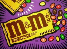 the m & m's logo is on top of a candy bar wrapper