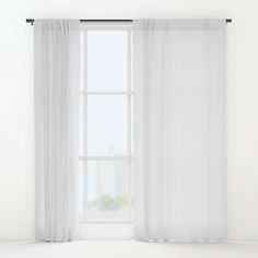 an open window with white sheer curtains