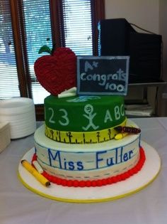 there is a cake made to look like a teacher's desk