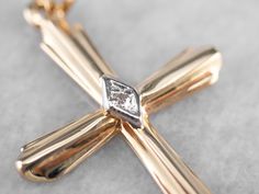 This diamond cross is the perfect everyday piece and would make a great First Communion or Confirmation gift! Crafted of both yellow and white gold, this stately pendant is set with a diamond accent at the center for a look that is special without being ostentatious. This pendant does not come with the chain shown. Please feel free to contact us, we will help you find the perfect chain for your style and budget! Metal: 14K Yellow and White Gold Gem: Diamond Gem Measurements: 0.8 mm, Round Measur Gold Cross Pendant, Diamond Cross, Confirmation Gifts, Gold Cross, Cross Pendant, Two Tone, Gems, White Gold, Chain