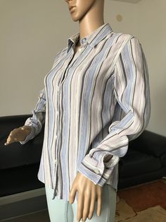 Button up women's vintage shirt. Striped crinkle fabric blouse.   PRODUCT DETAILS - Brand: Next  - Size: Based on the measurements below this would best fit a size M (10). Please view measurements in the photos! - Color: Lilac, blue, white and brown stripes                        - Fastening: buttons - Condition: Excellent vintage condition   MEASUREMENTS (laying flat). Please view the photos! - Length - 24 3/4" (63 cm) - Pit to pit - 19 2/3" (50 cm) - Shoulder to shoulder: 15" (38 cm) - Sleeve Summer Long Sleeve Crinkle Texture Blouse, Long Sleeve Crinkle Texture Blouse For Work, Summer Long Sleeve Blouse With Crinkle Texture, Long Sleeve Blouse With Crinkle Texture For Work, Long Sleeve Blouse With Crinkle Texture For Summer, Casual Crinkle Texture Shirt For Spring, Long Sleeve Cotton Blouse With Crinkle Texture, Linen Blouse With Crinkle Texture, Cotton Long Sleeve Blouse With Crinkle Texture