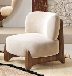 a white chair sitting on top of a rug