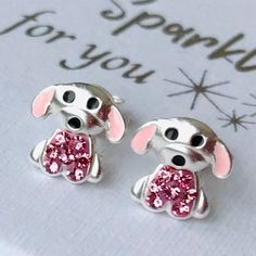 Sweet and cute puppy dog studs for the dog loving child. Sterling silver earrings with cerise pink cubic zircon stones for everyday wear. Small and delicate with detailed work.  Nickel free and lead free. Hypoallergenic. The push back stops comes with a silicon stop for extra security.  The earrings comes in a pretty gift box (6.5x6.5 mm, 2.55x2.55").PLEASE  NOTE: I offer free standard shipping. If you would like traceable postage, please let me know and I will create a separate payment of 6 USD Pink Sterling Silver Earrings For Birthday, Nickel-free Pink Earrings For Birthday, Playful Personalized Pink Earrings, Novelty Personalized Pink Earrings, Personalized Pink Novelty Earrings, Cerise Pink, Dog Earrings, Earrings Studs, Pink Dog