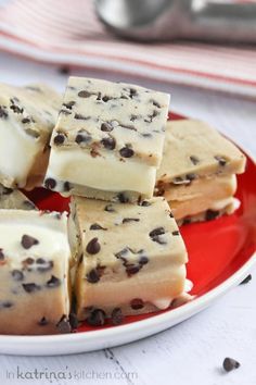 several pieces of chocolate chip cheesecake on a red plate