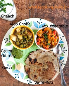 a plate with some food on it and two bowls of different foods next to each other