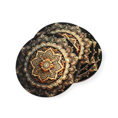 three black and gold decorative plates on a white background