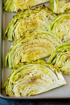 the cabbage is cut up and ready to be cooked in the oven on the baking sheet