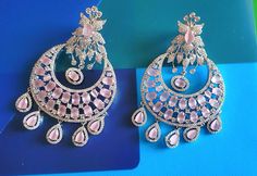 Silver Pastel pink Diamond Earrings Indian Pakistani bridesmaid wedding jewelry in silver plating Indian Jewelry are always a part of all the Indian celebration around the globe . One definitely complete her look once they own it . Beautiful  Indian cz earrings are plated in rhodium plating for longer lasting. This artistic silver cz Earrings looks beautiful  and elegant perfect for all occasion on any outfits you choose to wear (saree, salwar suits, lenga, etc.) *High quality craftsmanship 100% satisfaction guarantee  *Plated in rhodium plating *Earring Closure push black on earring  *base metal for earrings is brass * Earring length 7.7cm *Earring width 4.6cm  *package include earrings  *ready to ship from Houston TX United States GIFT- It comes in gift box perfect for gifting to your mo Formal Pink Chandelier Earrings, Rose Gold Earrings For Wedding And Festive Occasions, Pink Jewelry For Formal Festive Occasions, Pink Formal Jewelry For Festive Occasions, Festive Rose Gold Wedding Earrings, Elegant Pink Earrings For Reception, Elegant Pink Earrings For Festive Occasions, Elegant Pink Round Chandelier Earrings, Elegant Pink Bridal Earrings For Celebration