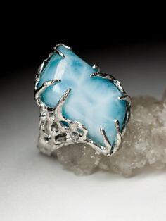 Silver ring with natural Larimar larimar origin - Dominican Republic stone measurements - 0.31 х 0.51 х 0.91 in / 8 х 13 х 23 mm ring weight - 11.64 grams ring size - 7 US ref No 8561 Worldwide shipping from Berlin, Germany. Prices include all taxes, valid in Germany and in European Union countries on the Customer's order date. Price does not include import taxes and custom duties. It is the Customer's full liability to pay any possible customs duties, import taxes or other applicable and due by the concerned country's regulations. Please ensure prior to a purchase that you know and understand payment requirements of rights as well as performance of any formalities resulting from their import or use applicable by your country's competent authorities and institutions. Unique Turquoise Larimar Gemstone Ring, Unique Turquoise Larimar Ring, Unique Blue Larimar Jewelry, Unique Larimar Turquoise Ring As Gift, Blue Larimar Gemstone Jewelry, Handmade Turquoise Larimar Rings, Blue Larimar Jewelry For Jewelry Making, Larimar Turquoise Ring Gemstone Gift, Larimar Turquoise Ring Gift