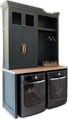 a washer and dryer sitting next to each other in front of a cabinet