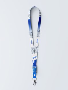 a lanyard strap with a blue and white design on it, hanging from the side