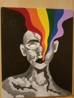 a painting of a man with a rainbow painted on his face