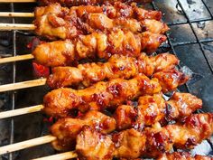 chicken skewers are being cooked on the grill