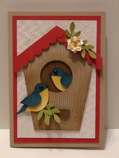 a card with two birds in a birdhouse