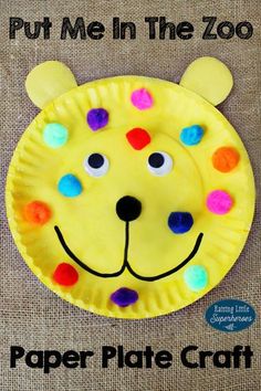 the paper plate craft is made to look like a zoo animal with colorful dots on its face