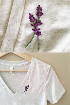 a white shirt with purple flowers on the left and right side, next to a t - shirt hanger