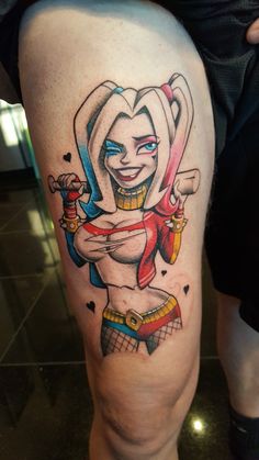 a person with a tattoo on their leg that has an image of harley in it