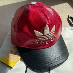 Brand New Gucci X Adidas Collaboration Red And Black Coated Canvas All Over Gg Monogram Baseball Cap. Designer Gucci Baseball Cap With Embroidered Logo, Gucci Casual Baseball Cap With Curved Brim, Casual Gucci Baseball Cap With Curved Brim, Luxury Gucci Baseball Cap, Designer Streetwear Cap, Designer Baseball Cap For Streetwear, Luxury Curved Visor Hat For Streetwear, Casual Gucci Hat With Embroidered Logo, Casual Gucci Cap