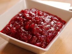 a white box filled with cranberry sauce on top of a table