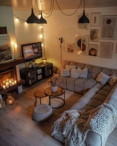 a living room filled with lots of furniture next to a fire place in the corner