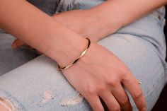 Our bangle bracelets are 14k solid gold. This hinged bangle bracelet will accompany you at any time of the day with its unique style. It has a safe clasp. It is a simple but at the same time very stylish and delicate bracelet with an asymmetrical pattern on it. If you consider this gold minimalist geometric bracelet as a gift, it will make your loved ones happy on their birthdays, Valentine's Day, Mother's Day, anniversaries, or graduations.  The gold bangle bracelet's inner diameter is approx. 14k Gold Adjustable Bracelet, Elegant Bangle With Simple Design, Minimalist Rose Gold Bangle Jewelry, Minimalist Rose Gold Bangle, Flexible 14k Gold Minimalist Bracelets, Minimalist Flexible 14k Gold Bracelets, Minimalist 14k Gold Flexible Bracelets, Minimalist 14k Gold Flexible Bracelet, Elegant 14k Gold Bracelet With Simple Design