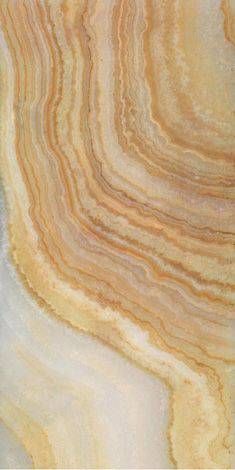 an image of a marbled surface that looks like it has been painted gold and white