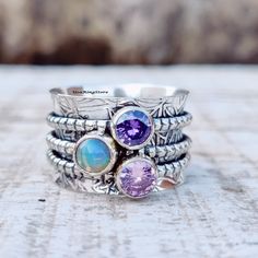 Welcome In USARingStore Title -Opal, Amethyst Spinner Ring, 925 Sterling Silver Ring, Spinning Ring, Three Stone Spinner Ring, Meditation Ring, Handmade Ring, Gift For Her Welcome In USA Ring Store PRODUCT DESCRIPTION Spinner Ring, 925 Sterling Silver, Meditation Fidget Ring,Wide Band Ring, Chunky Ring, Worry ring, Thumb ring, PRODUCT DESCRIPTION Material - 925 Sterling Silver My Shop Link :- https://www.etsy.com/in-en/shop/Bijouxsilverart/edit?ref=seller-platform-mcnav Ring Size - All Measureme Bohemian Sterling Silver Opal Birthstone Ring, Sterling Silver Multi-stone Opal Ring As Gift, Unique Sterling Silver Stackable Opal Ring, Welcome In, Ring Spinning, Funky Rings, Ring Three Stone, Spinning Ring, Meditation Ring