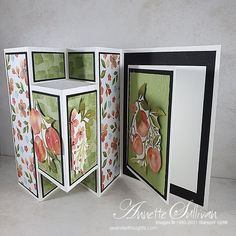 an open handmade card with flowers and fruit on the inside, in white background